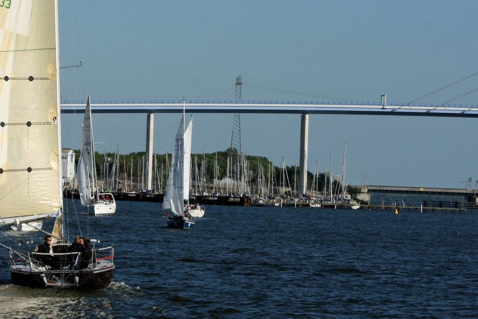 The piers of the Dänholm water sports centre in front of the two Rügen Bridges